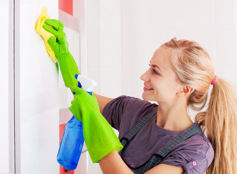 Office cleaner maintaining a workspace in W13