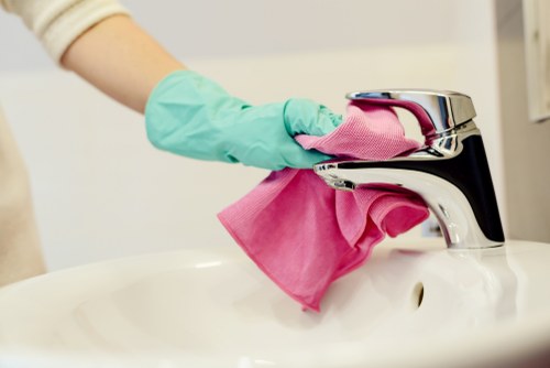Office cleaner working in a W13 workspace reception area